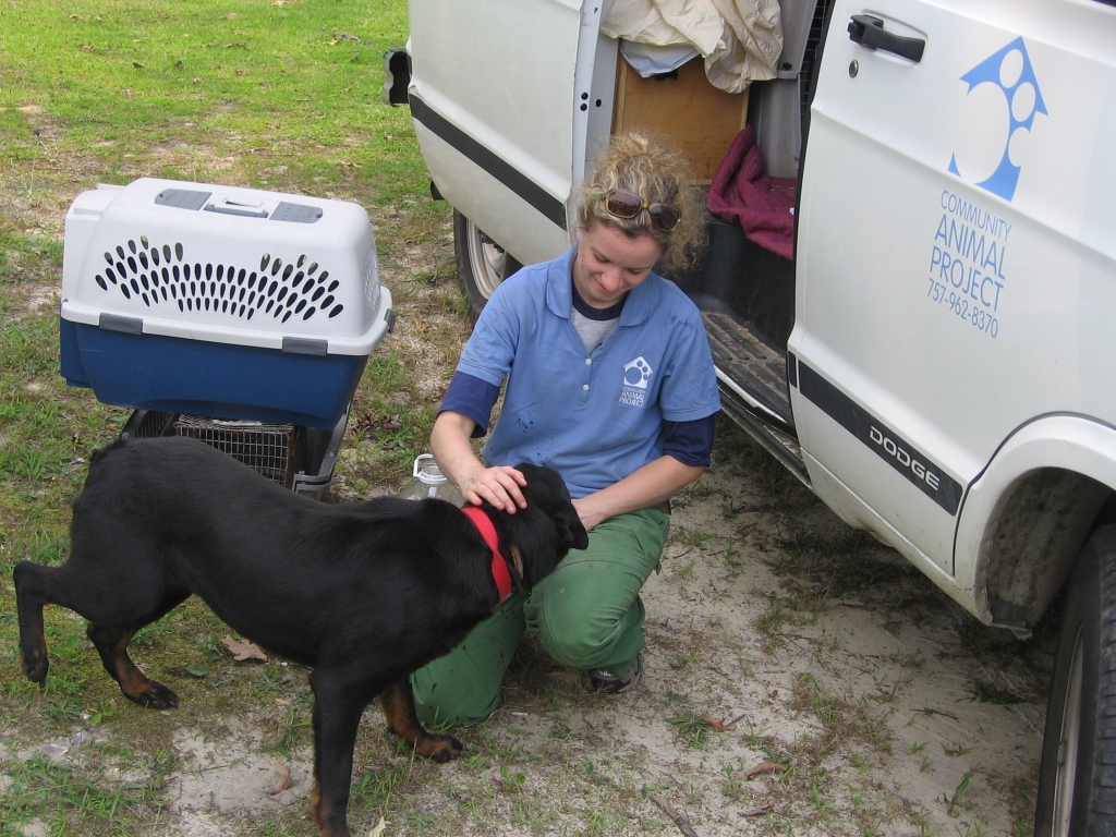 Emily Allen petting dog outside of CAP van